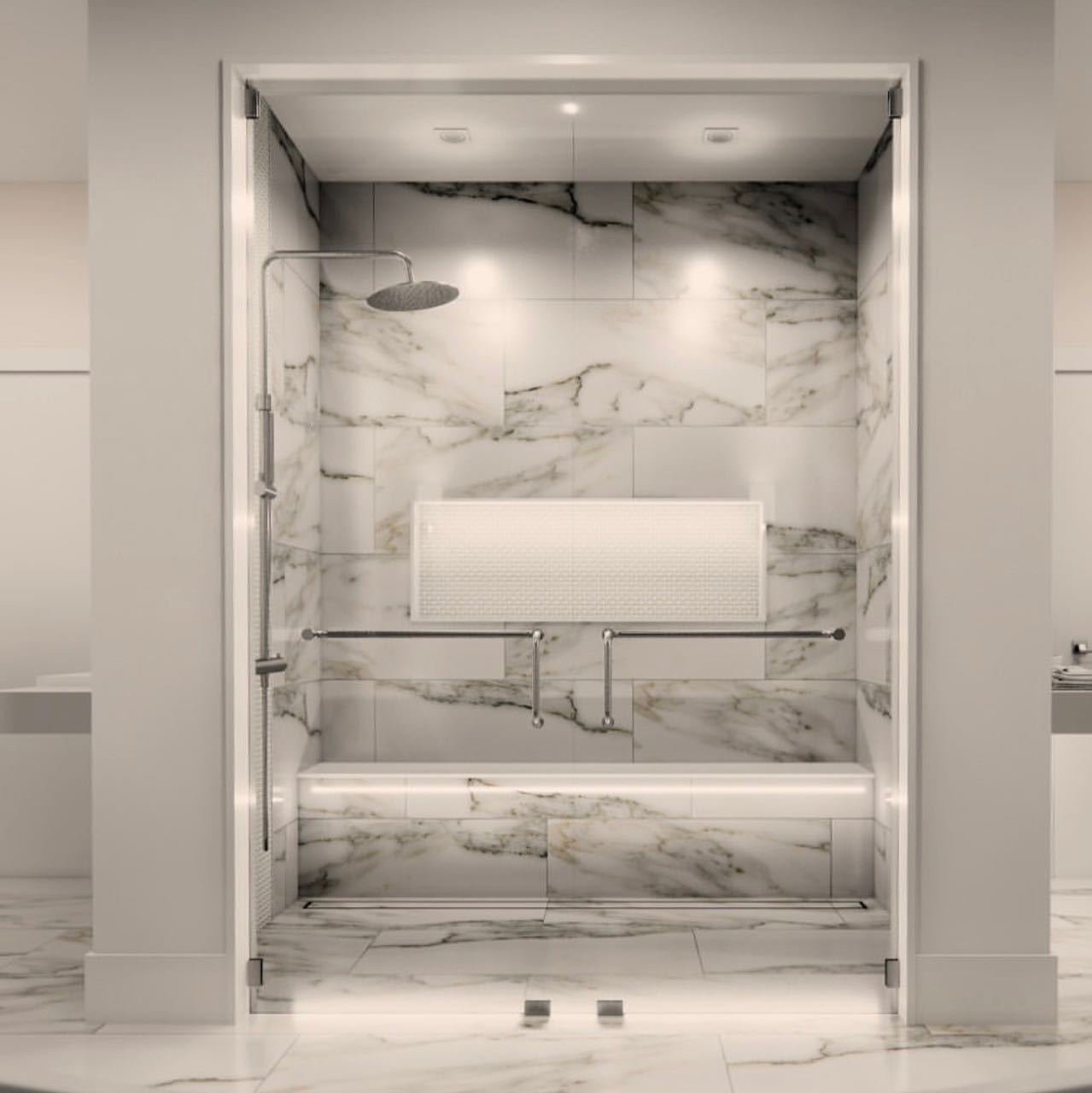 White marble shower alcove with rain head, floating bench and backlit recessed niche