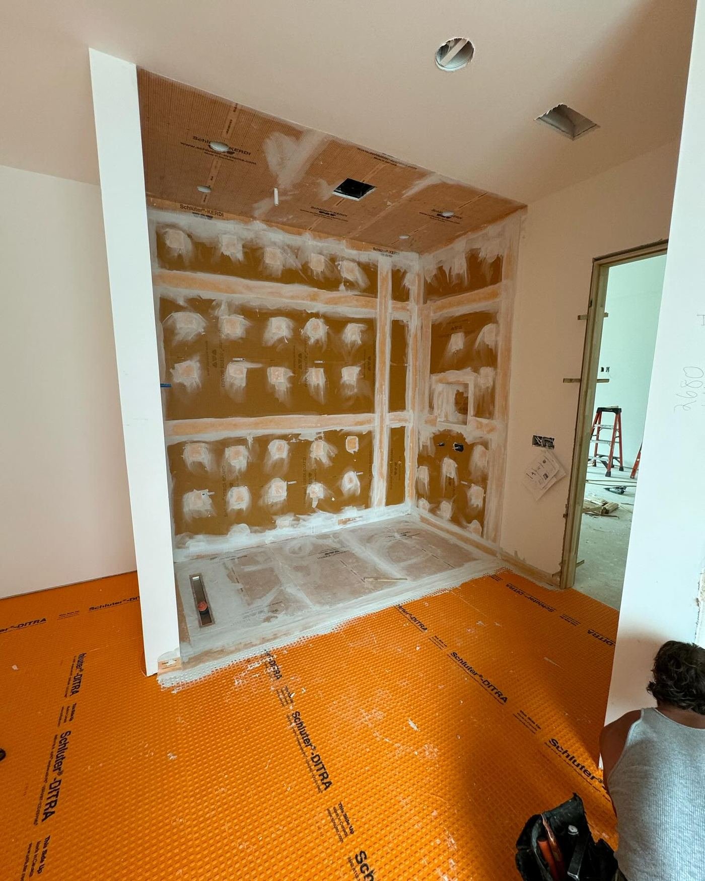 Schluter Kerdi-Board waterproofing membrane installed in a shower enclosure