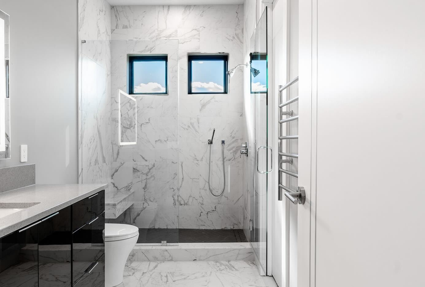Master bathroom with double vanity and glass shower by Hands of Freedom